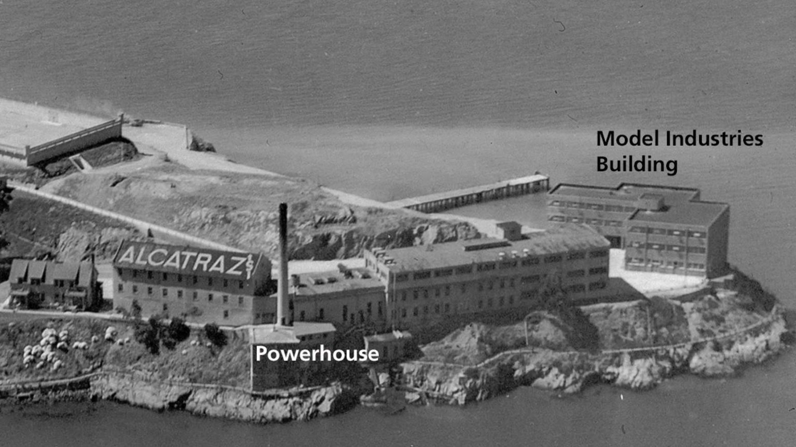 Black and white aerial view of the Modern Industries Building on Alcatraz Island