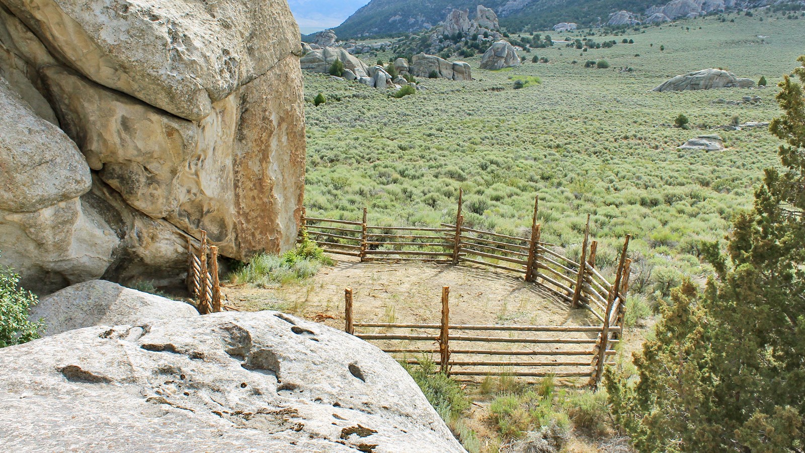 Corral nestled against granite formations in City of Rocks.