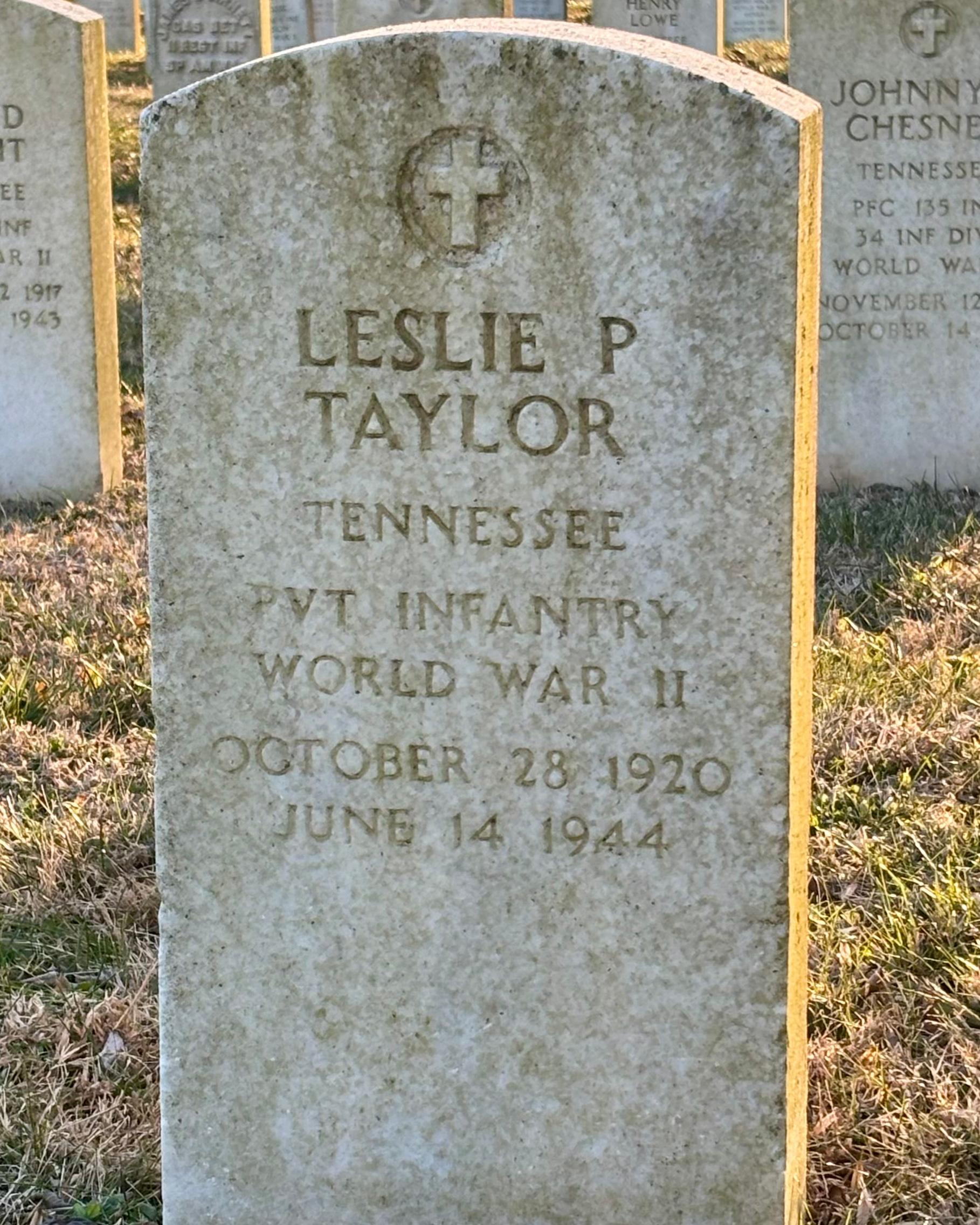 Headstone reading "Leslie P Taylor Tennessee PVT Infantry WWII October 28 1920 June 14 1944"