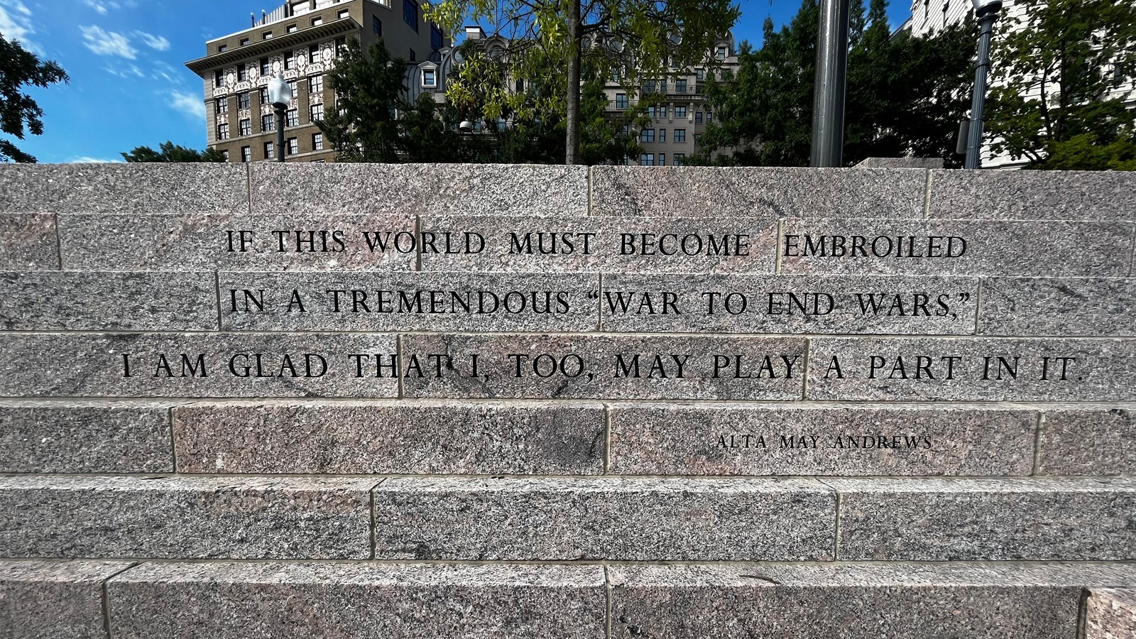 Grey colored stone steps with words etched on the front of each step