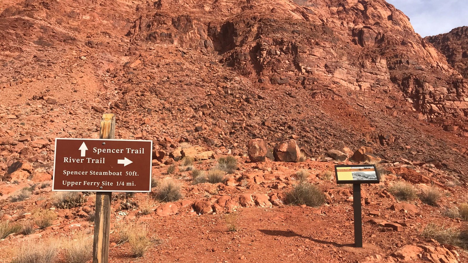 Interpretive sign and trailhead sign at base of Spencer Trail