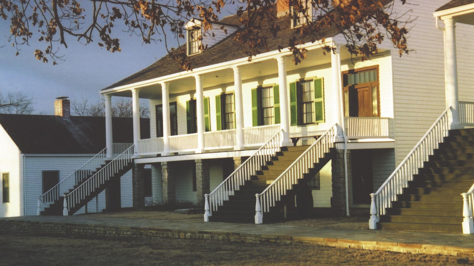 two story building with stairs  illuminated by sunset