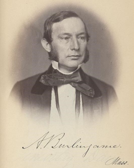 Portrait engraving of a white man with sideburns wearing a dark coat with a large bowtie.