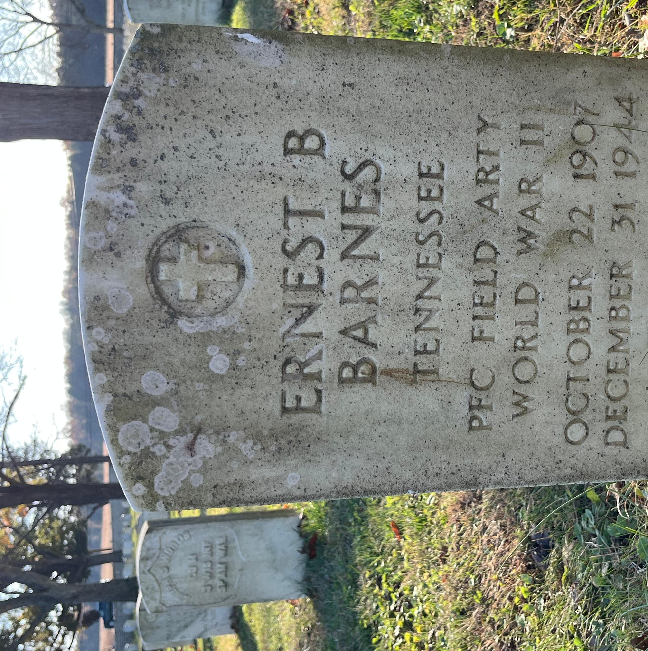 Headstone reading " Ernest B Barnes Tennessee PFC FIELD ARTY WWII October 22, 1907 December 31, 1944