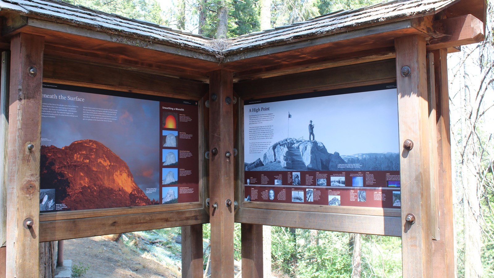 Two exhibit panels show images and share text about the geology of Moro Rock.