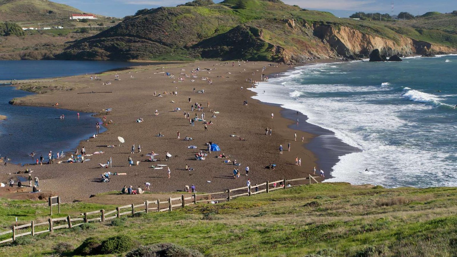 Many beachgoers enjoy a sunny day at Rodeo Beach