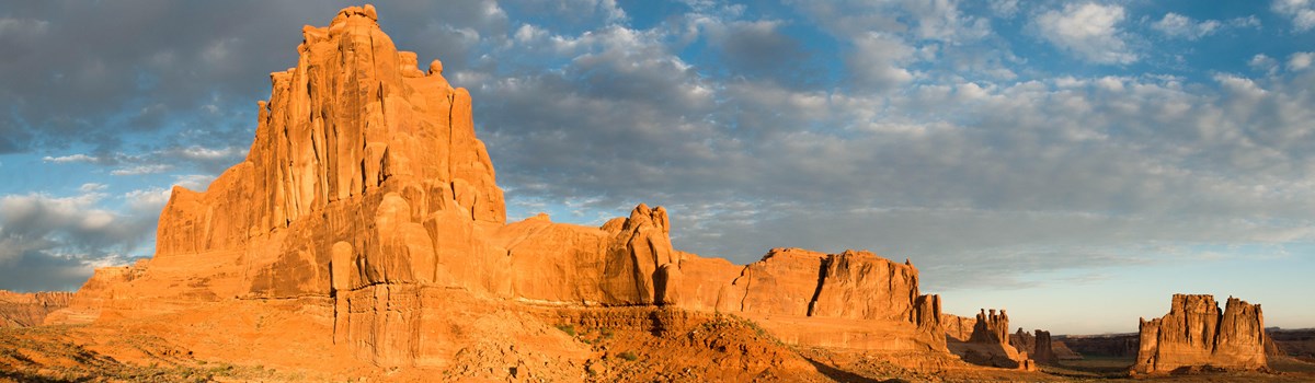 rock walls and formations illuminated by the rising sun