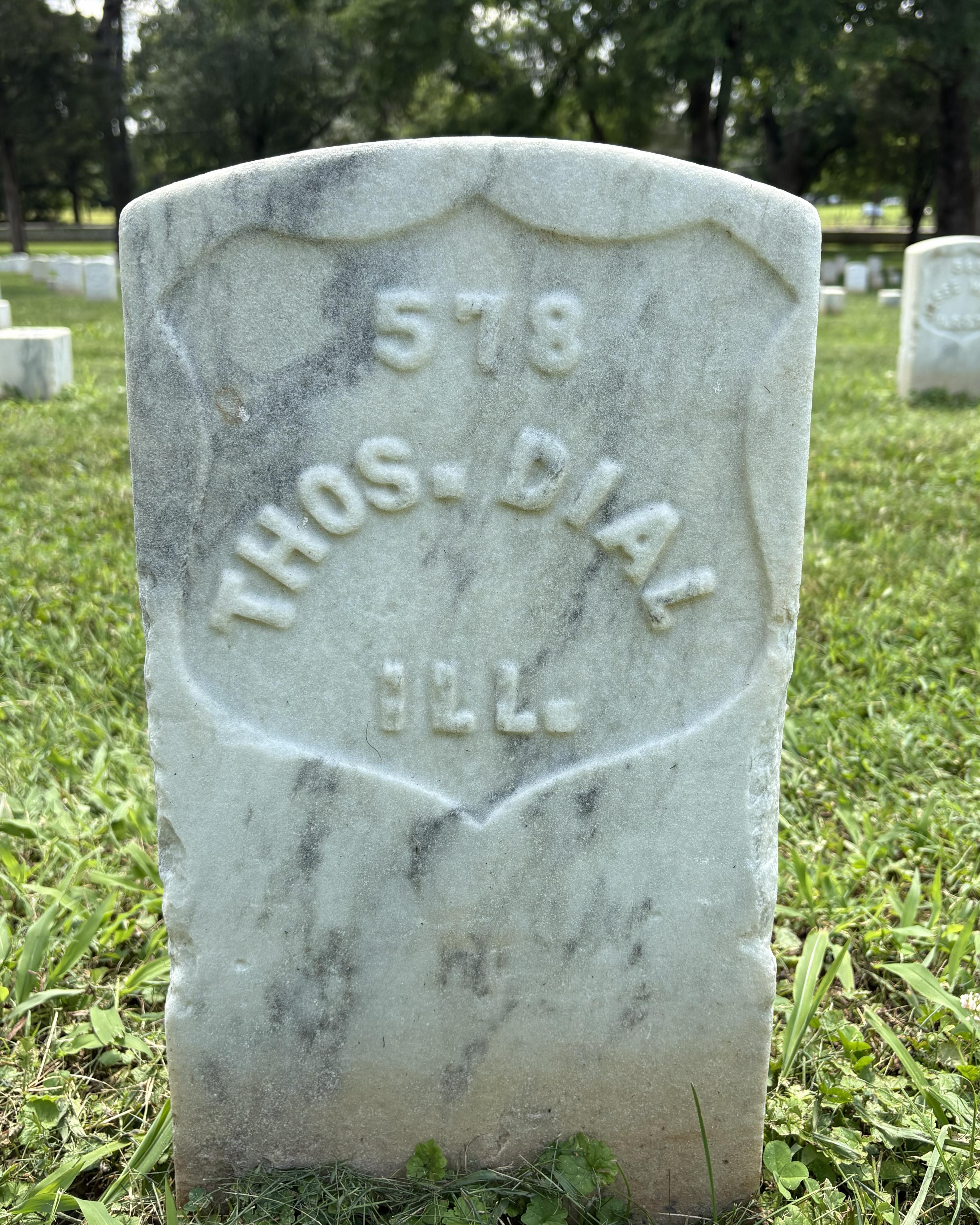 Marble headstone belonging to veteran Thomas Dial. 
