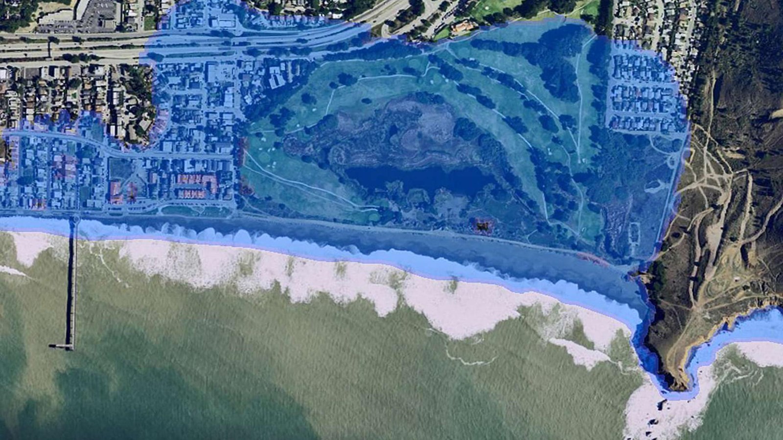 An aerial photo of Mori Point with a blue overlay showing the potential sea level rise.