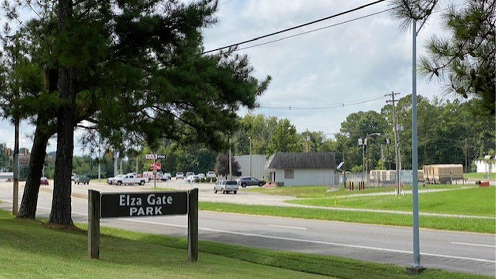 A roadside sign reads