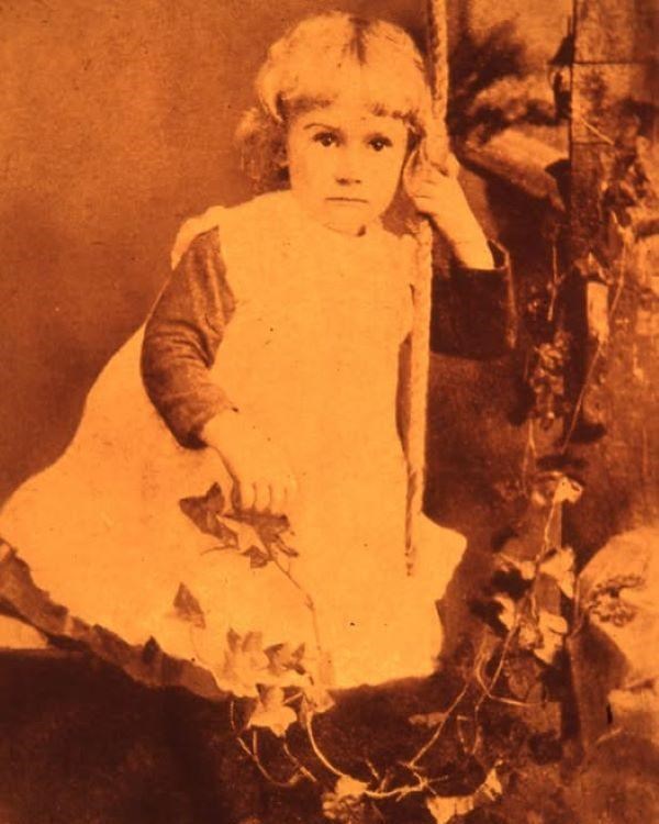 A young girl in a white dress