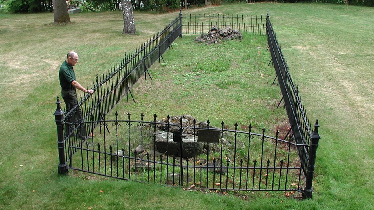 Iron fence surrounding chimney of mission site