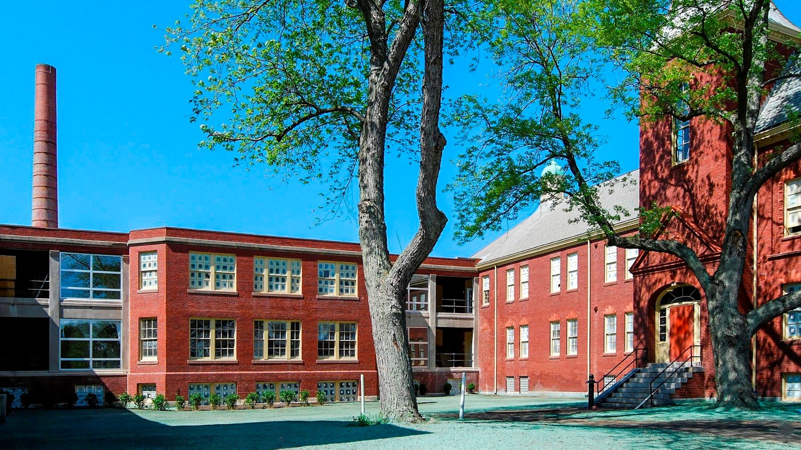 An L shaped red brick building