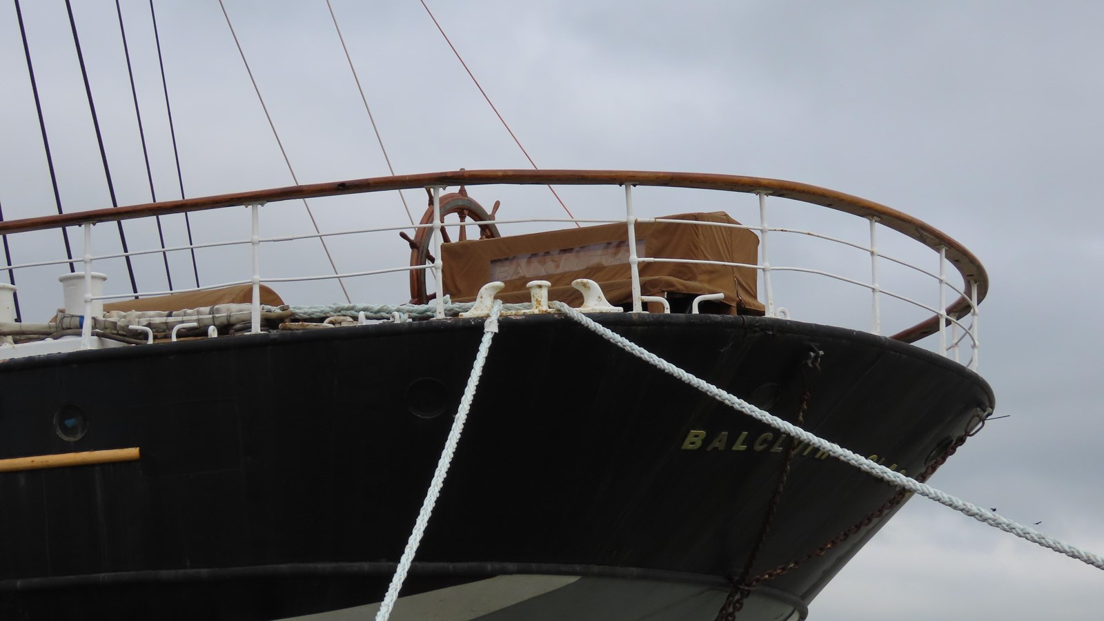 the stern deck of Balclutha, with the helm visible.