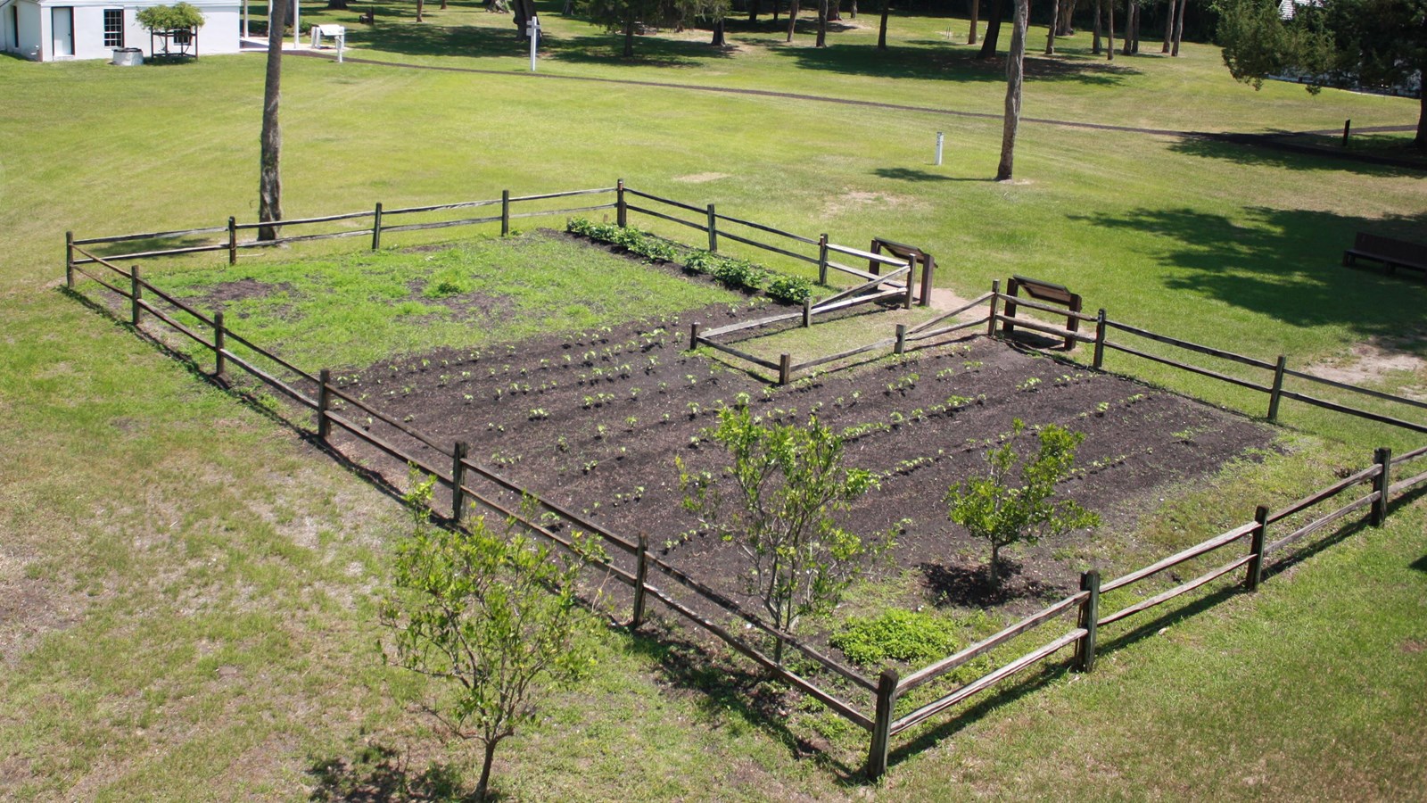 view of the garden from above with split rail fence 