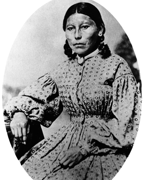 Black and white image of a Cheyenne woman in Victorian era dress