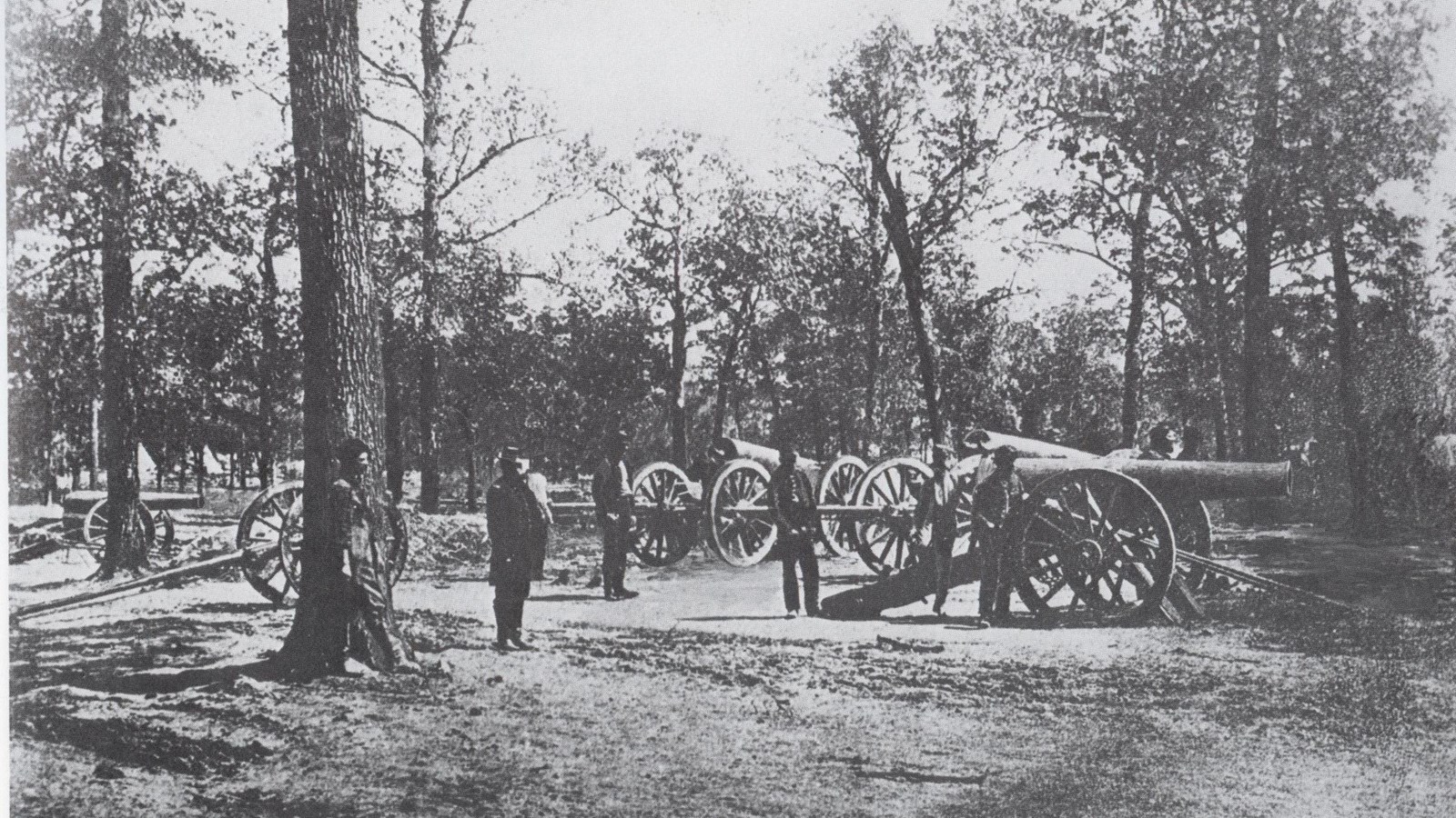 Historic black and white image of 24-pounders and artillerists at Shiloh.