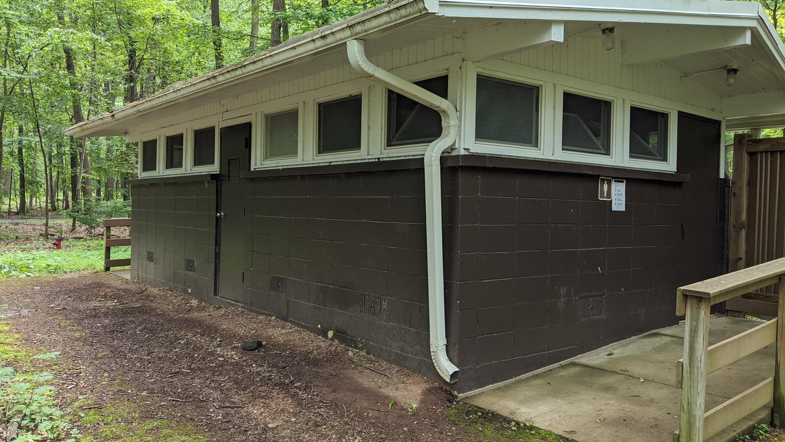 Brown and white building with wheelchair accessible ramp