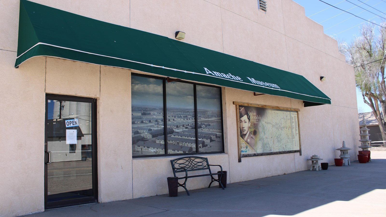 A building with a green awning that says