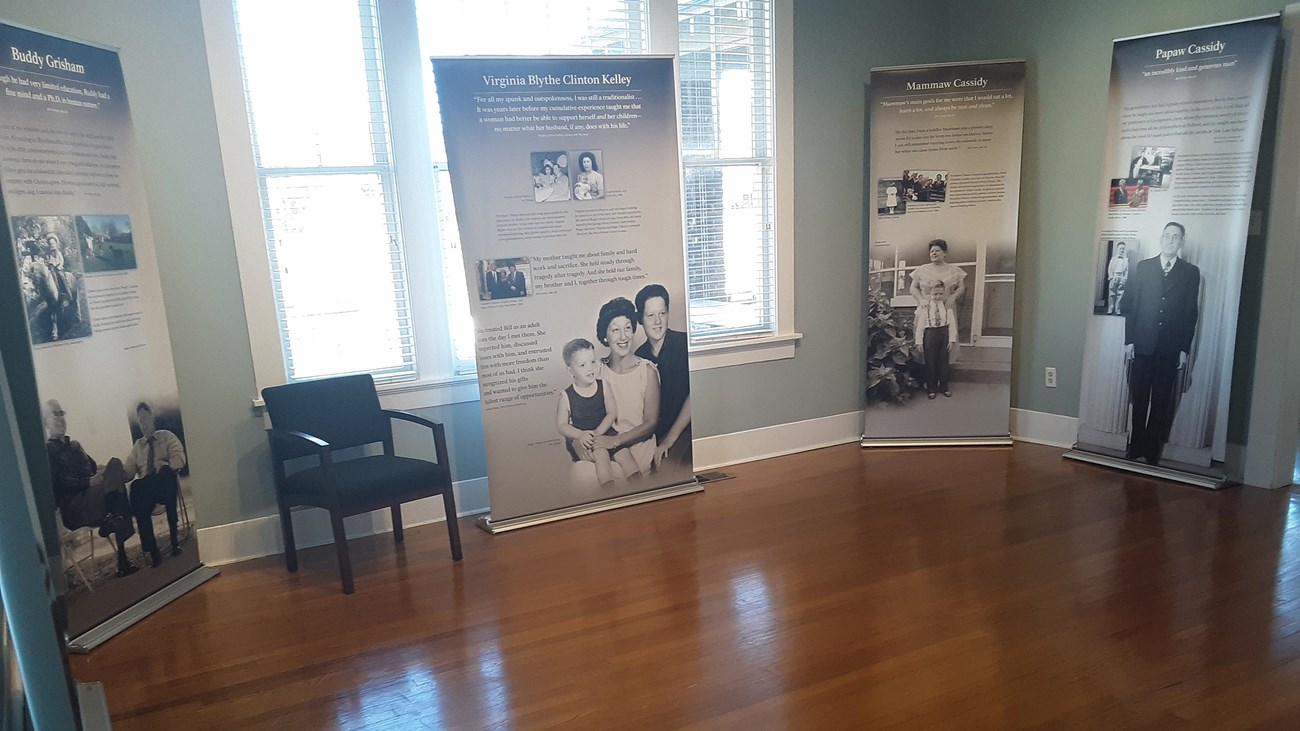 Exhibit panels describe the childhood and influences of President Bill Clinton.