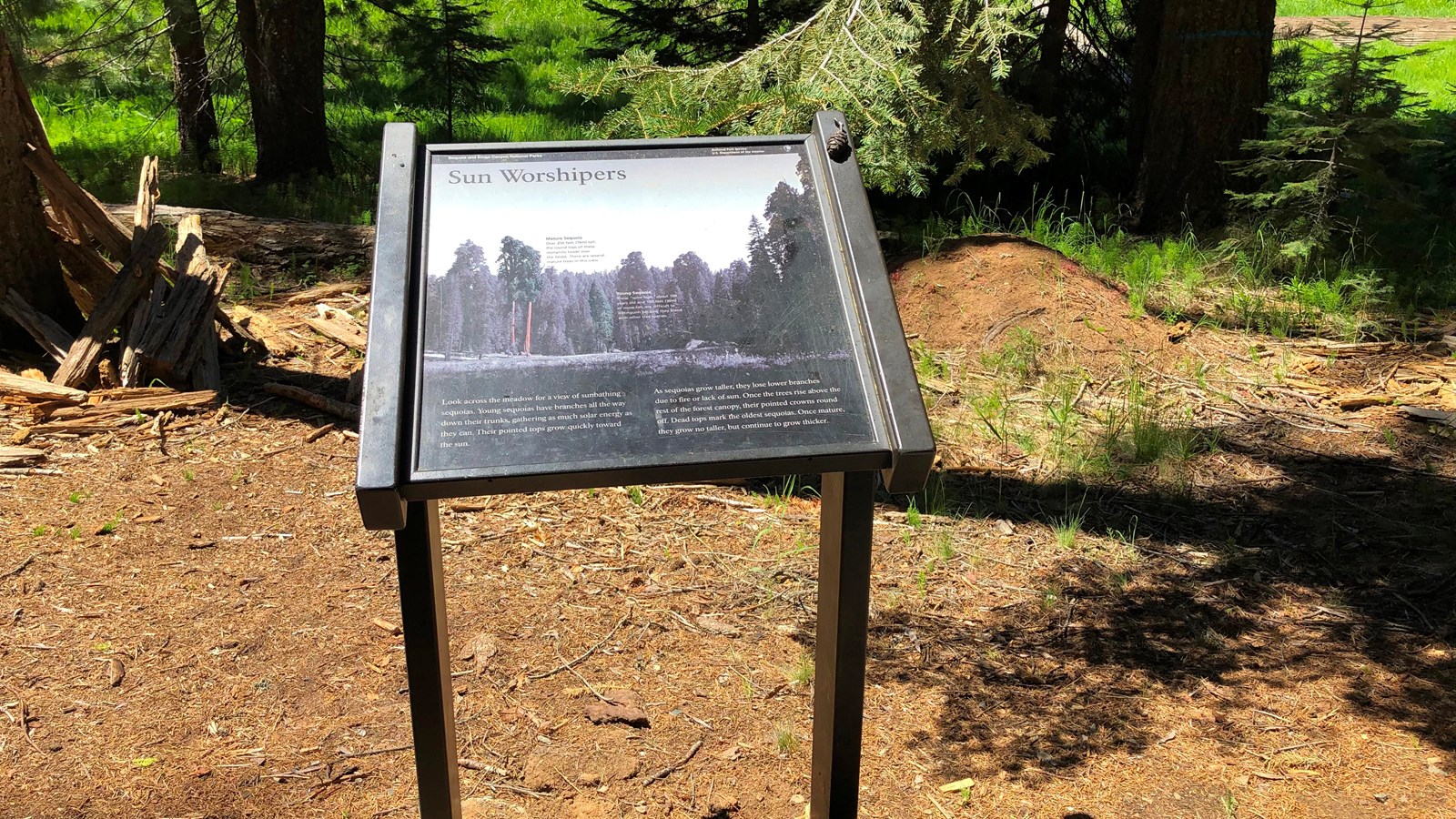 Small wayside sign explaining the meaning of Sun Worshipers