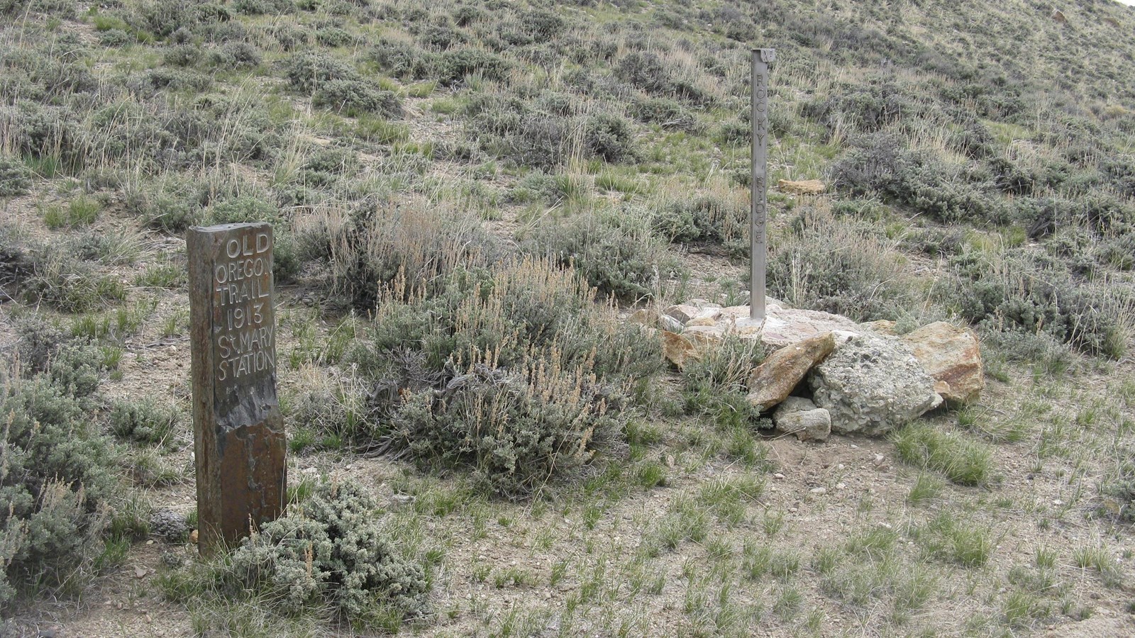 An upright stone tablet inscribed, “Old Oregon Trail 1913 St. Mary’s Station.