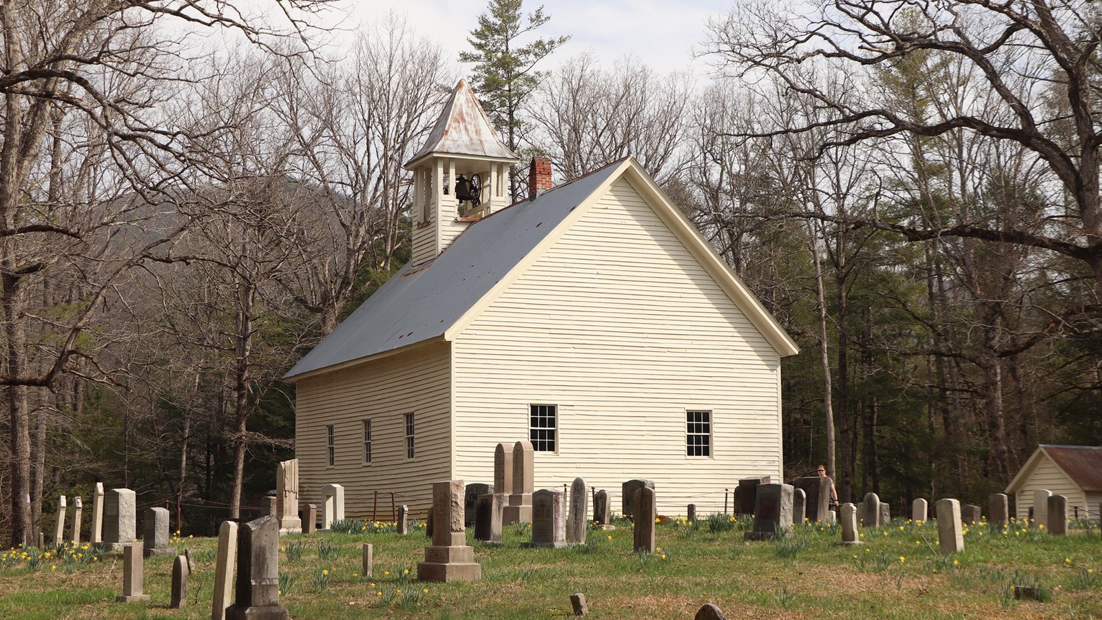A nineteenth century frame church with a white exterior.