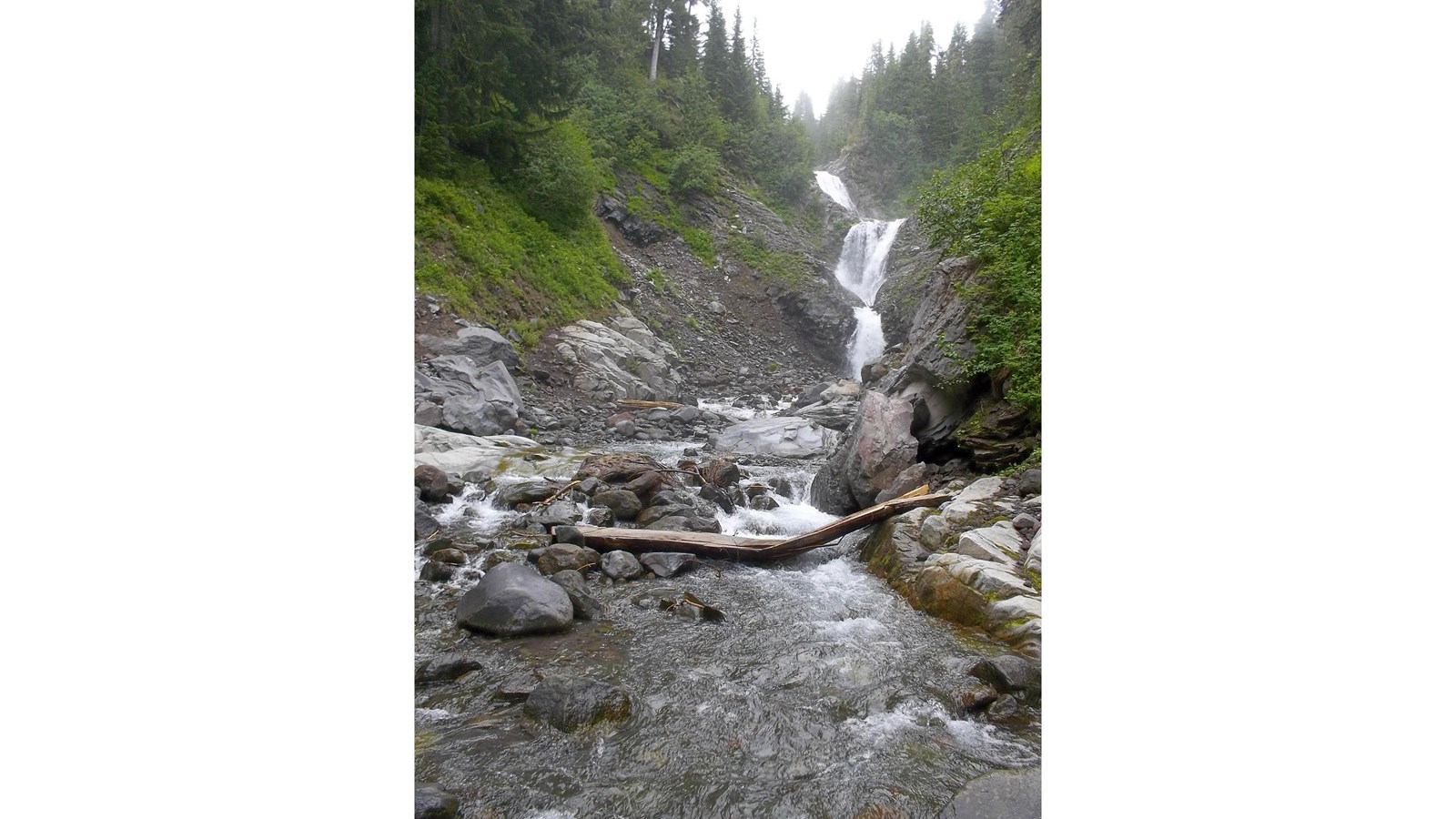Waterfall with a series of cascades, with the tallest about 65 feet high