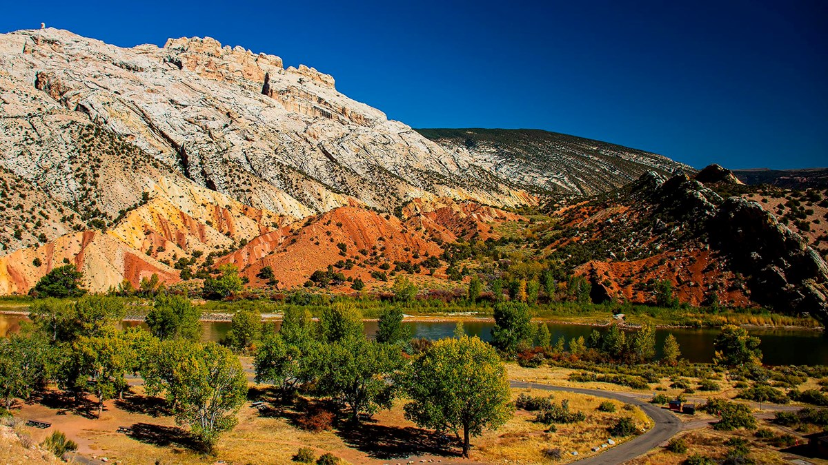 This view from the Cub Creek Road reveals Split Mountain rising above multicolored rock formations.