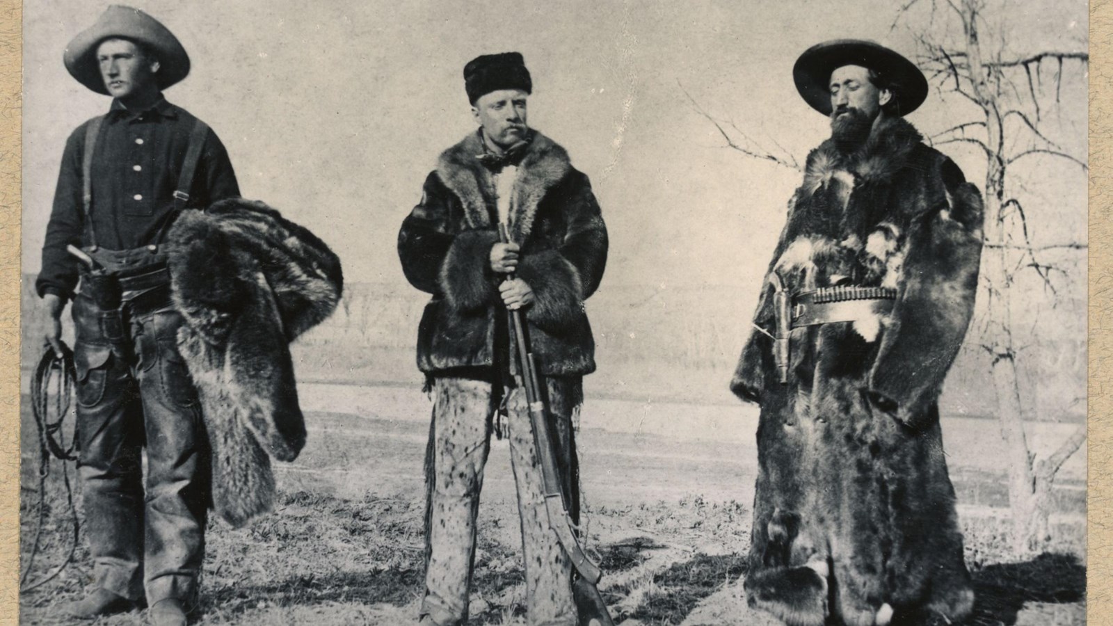 Roosevelt, Sewall, and Dow standing wearing heavy furs