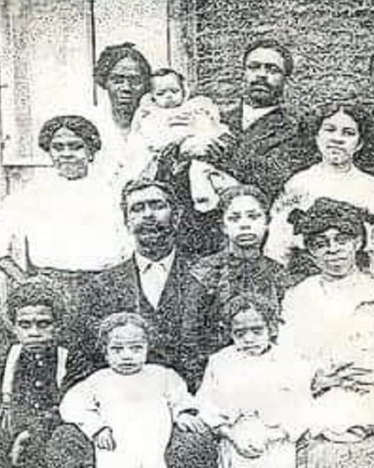 A cropped image of a group posing for a photo