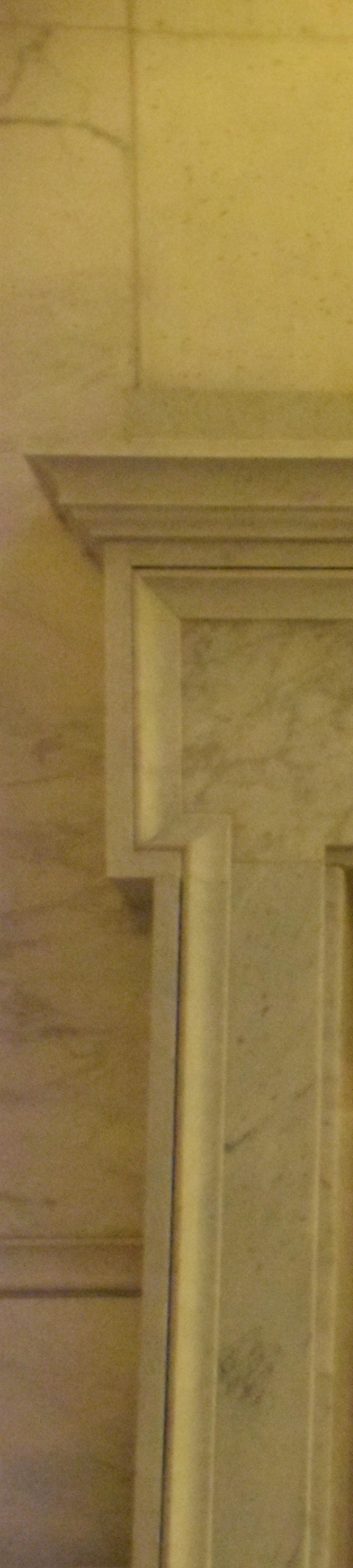 Stone door way framing a collection of Flags