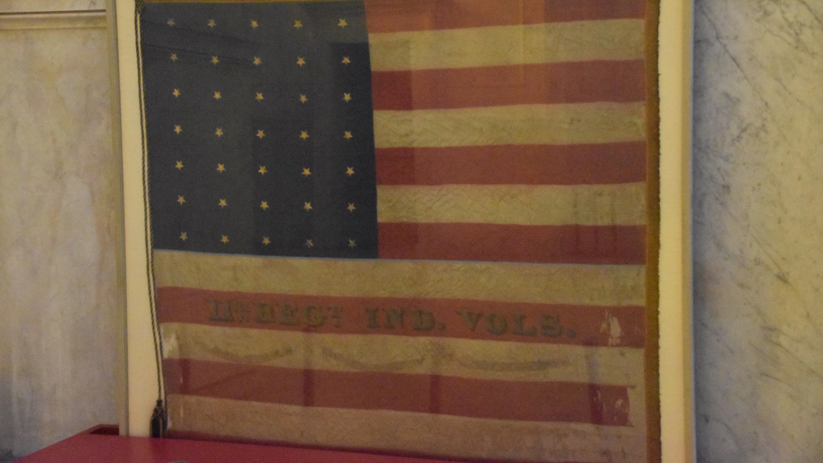 American flag in a glass display case