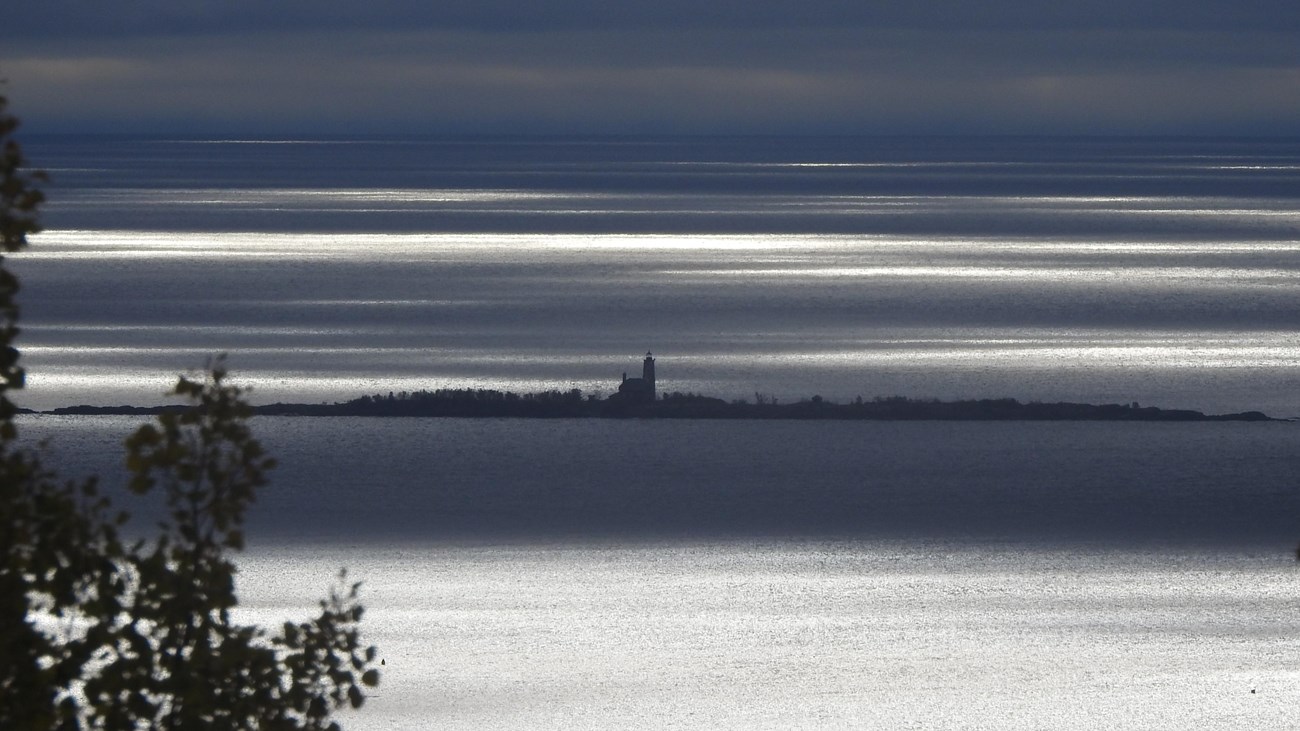 View of Lake, island, and lighthouse in the distance.