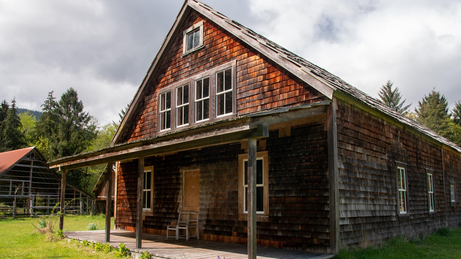 A large, wood-shingled, historic building