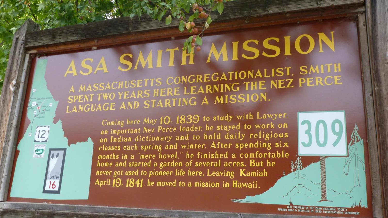 Interpretive wooden highway pullout sign with information on the Asa Smith Mission.