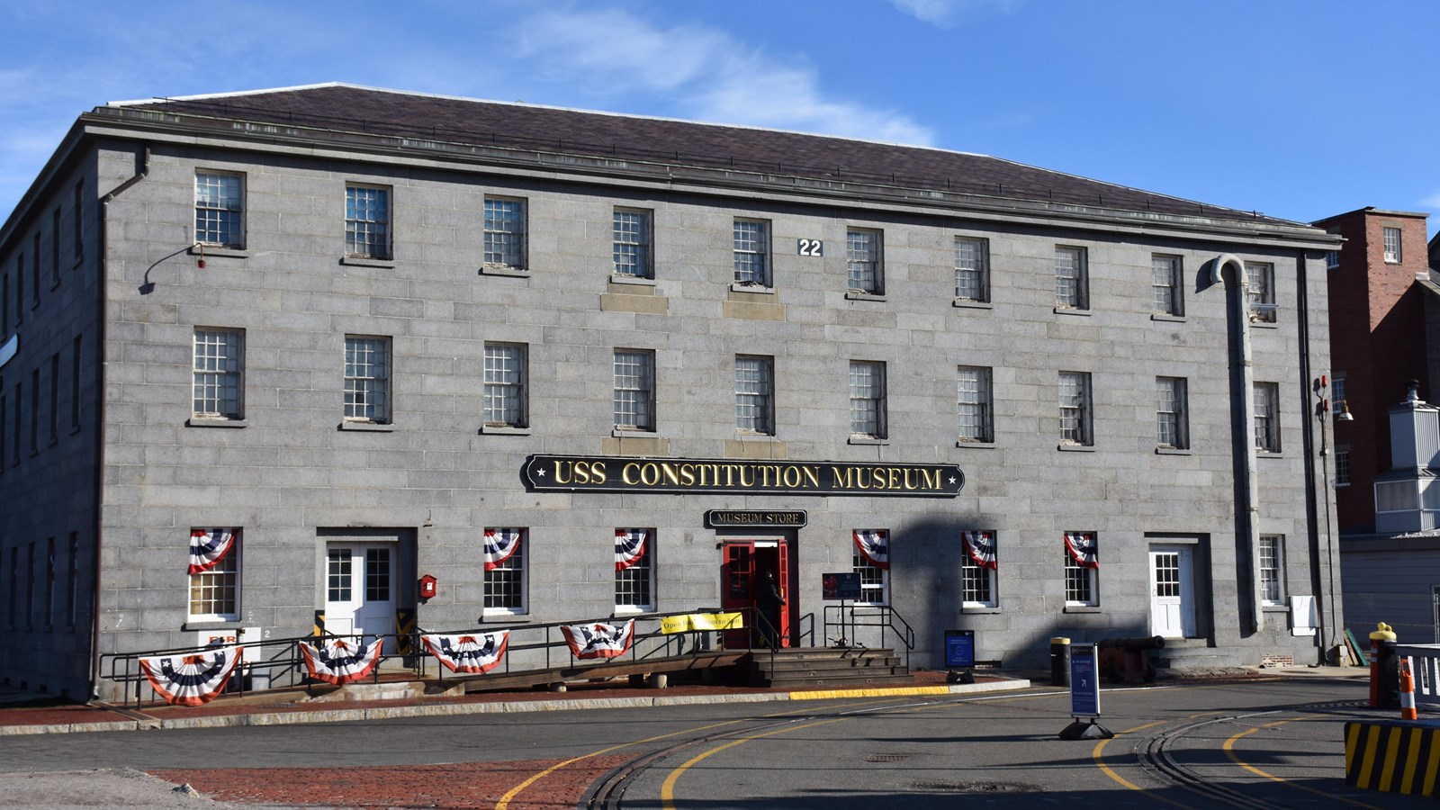 Three story granite building.