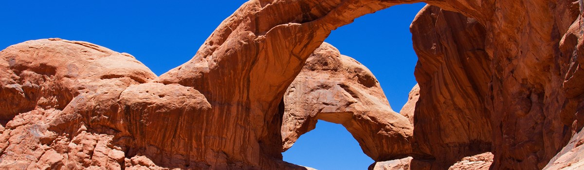to soaring arches that are joined at one end