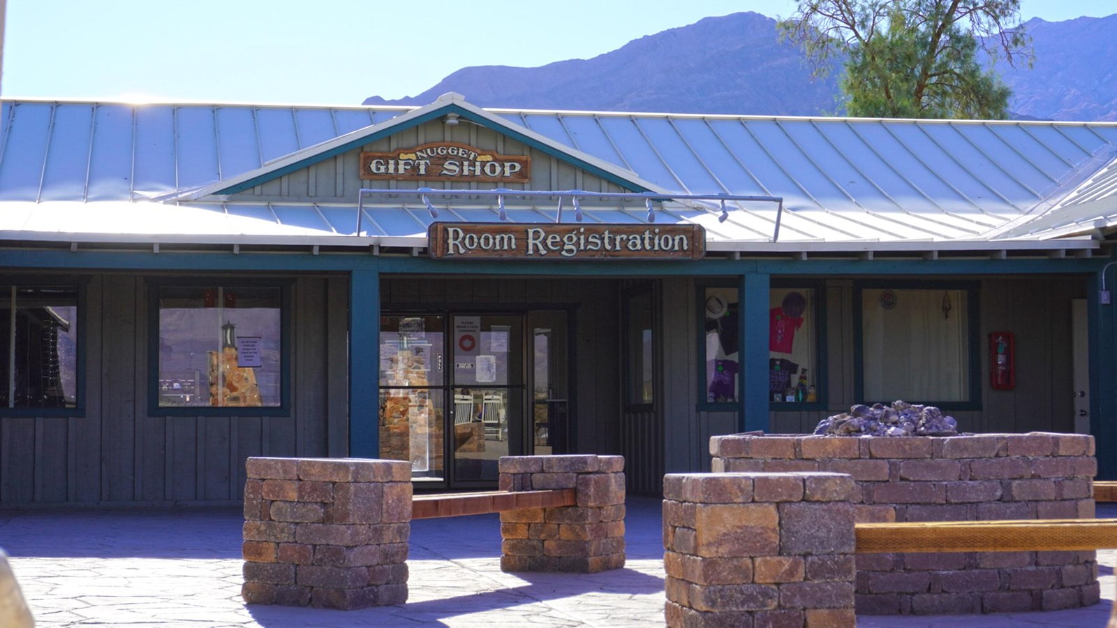Large single story building with signs reading
