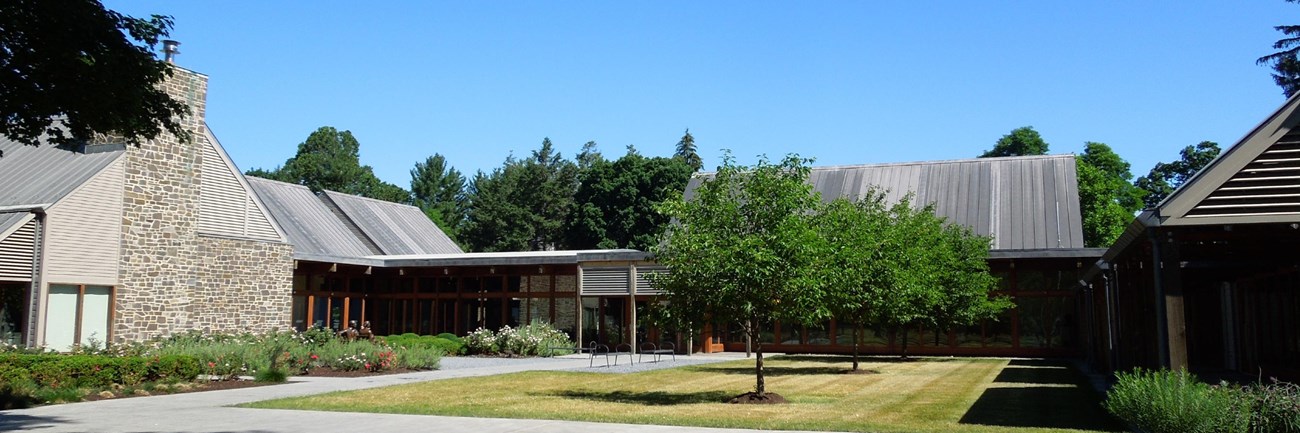 A building with multiple wings surrounding a central courtyard.