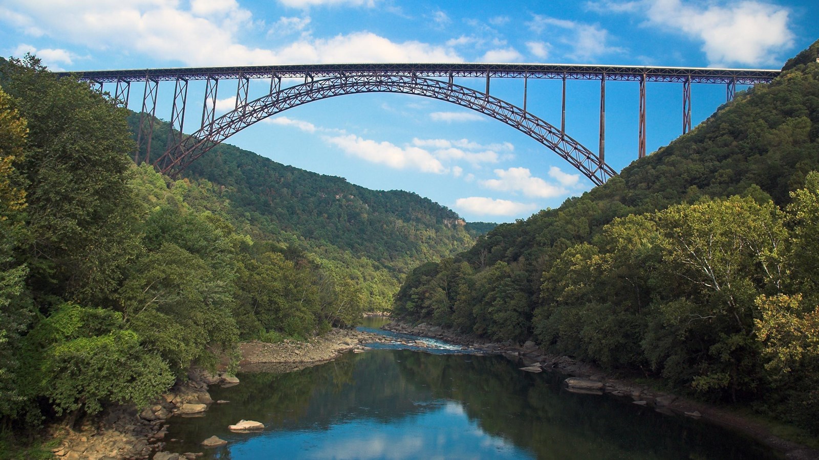 large bridge spans across river gorge