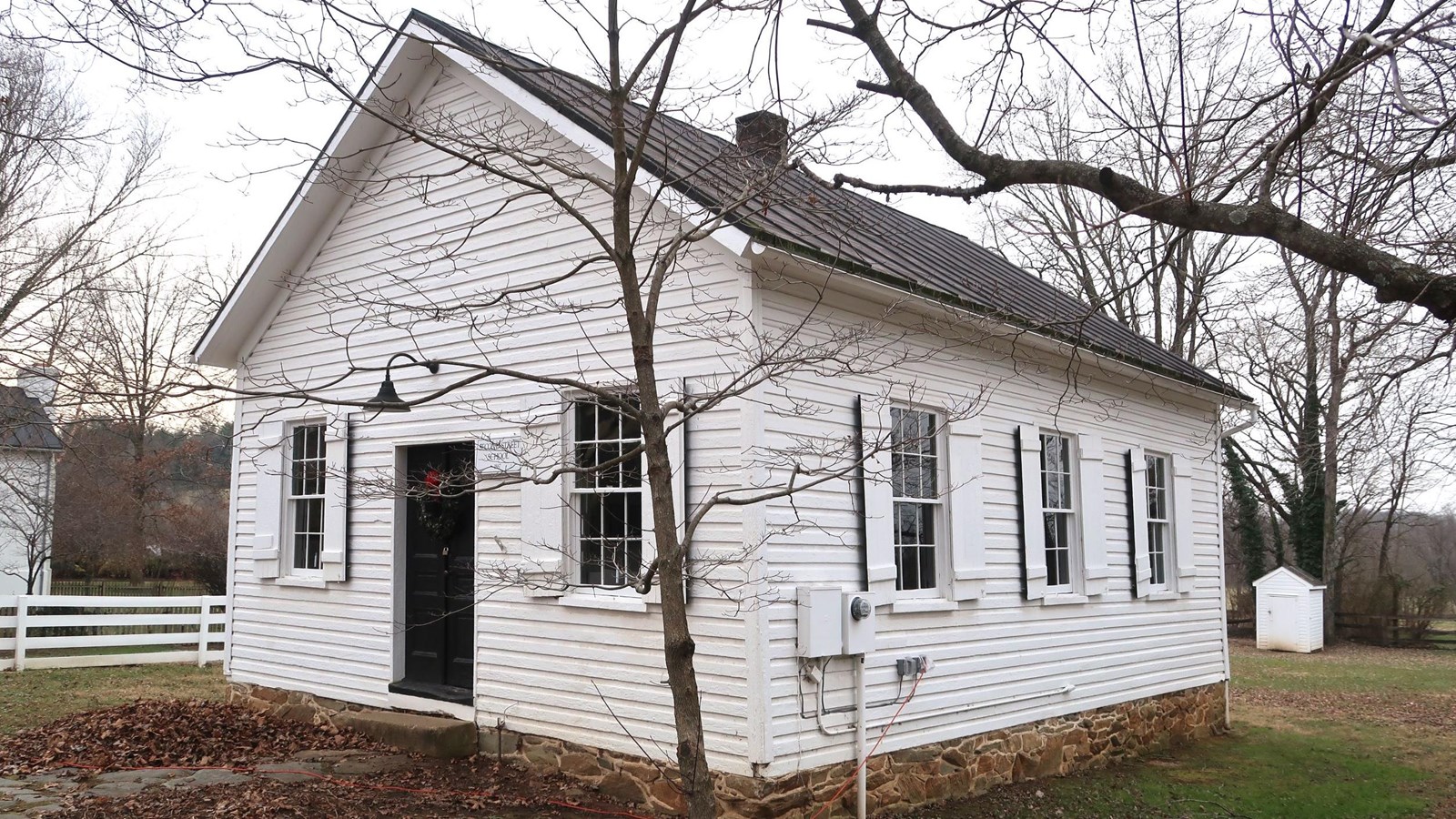one-story, three-bay, frame school building.