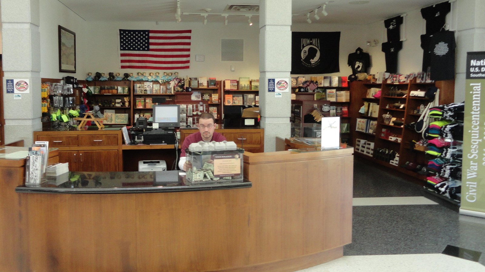 Park volunteer in front of park store.