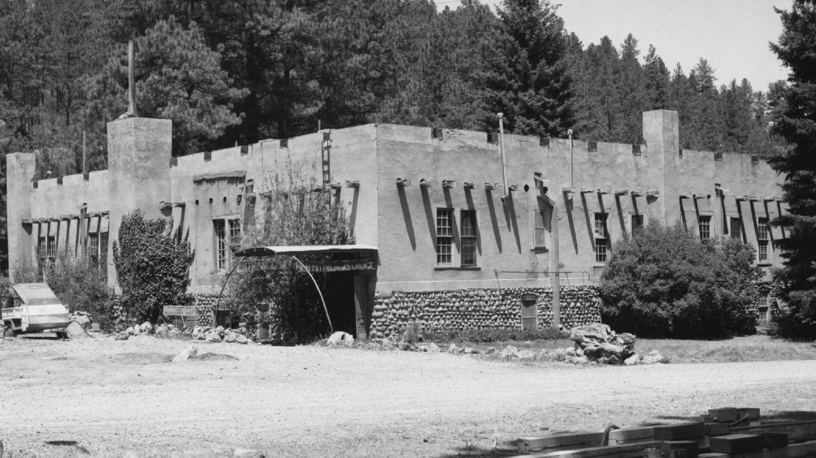 Corner of Pueblo-Revival style building with stucco exterior