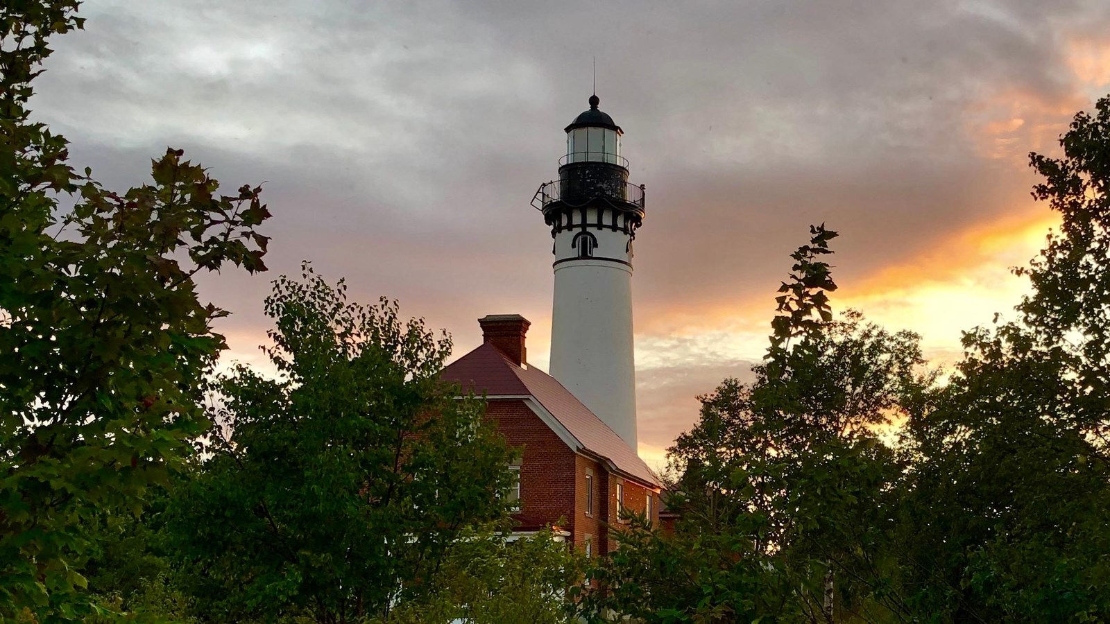 The Au Sable Light Station is an 86 foot tall lighthouse with attached assistant keepers house.