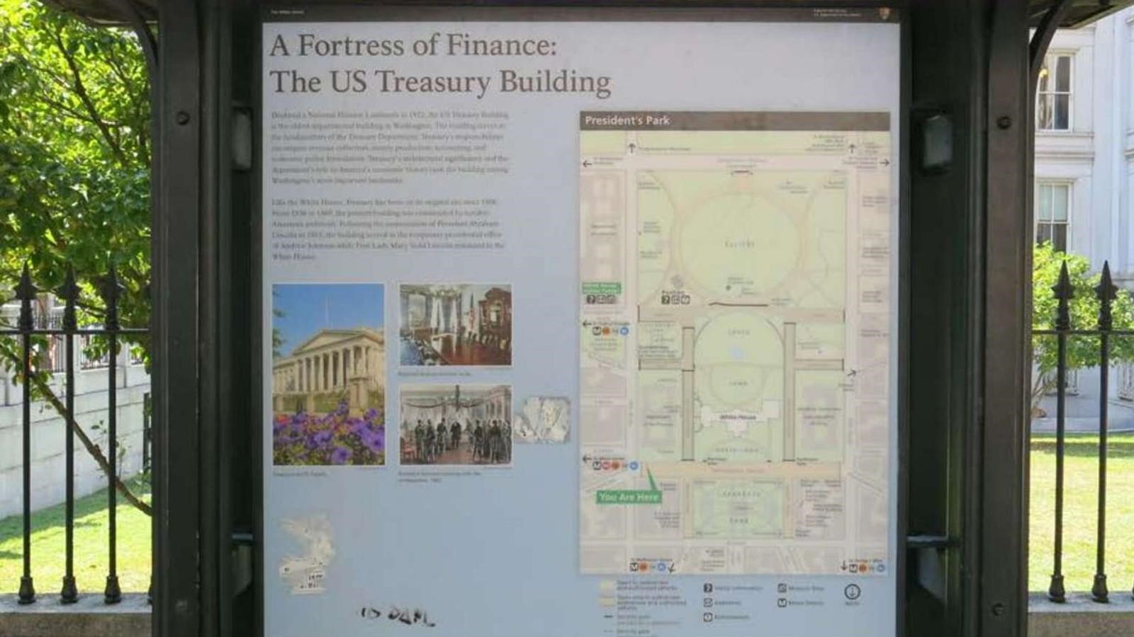 An interpretive panel describes the Treasury Building,