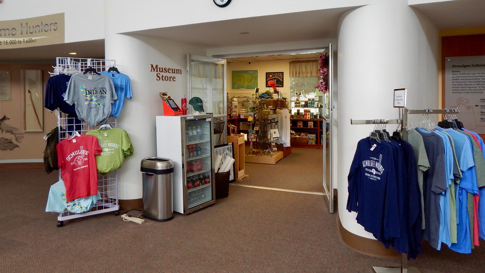 The entrance to the park store with several merchandise items displayed outside the doorway.