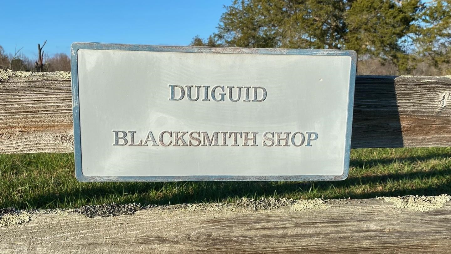 Metal sign reads
