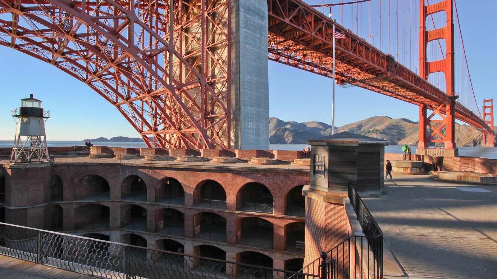 Looking down into the parade ground of the fort, with the golden gate bridge in the background