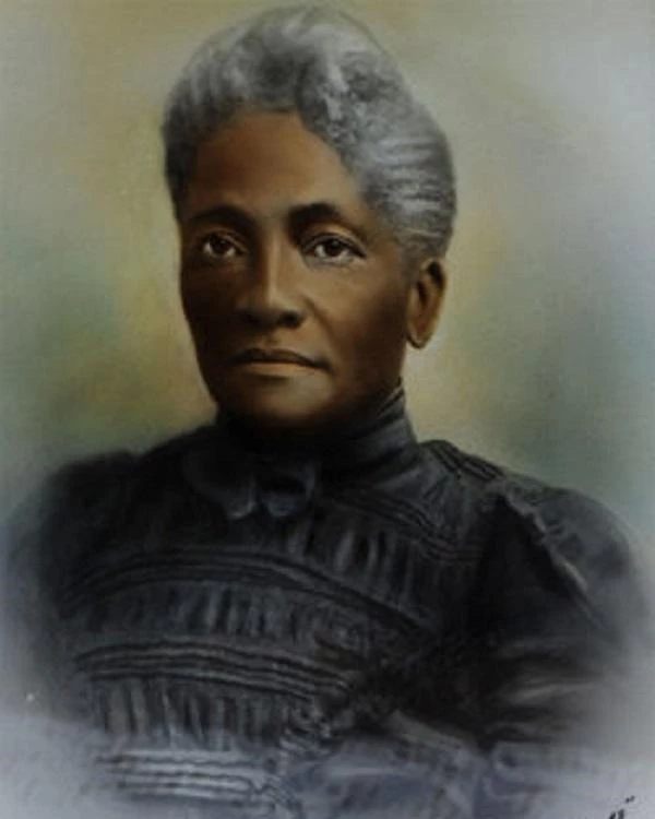 Elizabeth Draper painting wearing a black dress